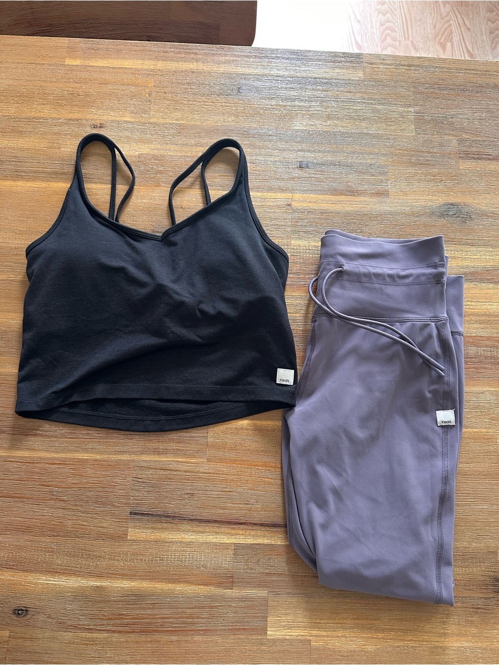 Vuori Black Cropped Strappy Sports Bra with Lavender Leggings